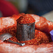 Chili Powder In A Container With A Poster