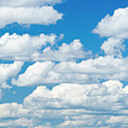 Cumulus Clouds In A Clear Blue Sky Poster