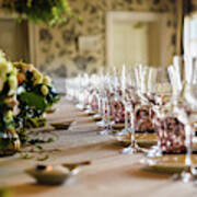 Elongated Table With All The Cutlery Elegantly Arranged And Beautiful Centerpieces Ideal For Decorating A Wedding. Poster