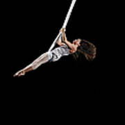 Female Aerialist Swinging On Suspended Poster