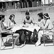 Group Of People Sitting Poolside At Poster