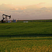 Oil Rig On A Grass Field With A Cloudy Poster
