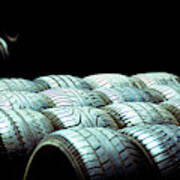 Old Tires And Racing Wheels Stacked In The Sun Poster