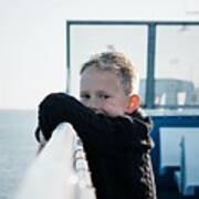 Portrait Of A Young Boy On A Ferry Looking Happy And Relaxed At Sea Poster