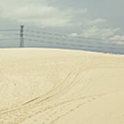 Pylon Atop Sand Dune Poster