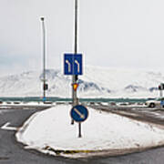 Snowy Traffic Junction Along Ocean Poster