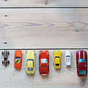 Toy Cars Lined Up In A Row On Floor Poster