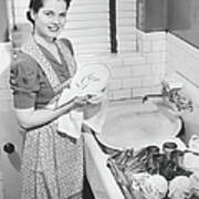 Woman Drying Dishes At Kitchen Sink Poster