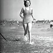 Woman In Swimsuit Running On Shoreline Poster
