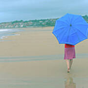 Woman With An Umbrella On The Beach Poster