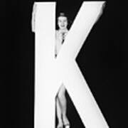 Woman With Huge Letter K Poster