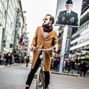 Berlin Hipster On  Bicycle At Checkpoint Charlie Poster