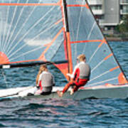 High School Students Sailing Small Sailboat In Competition On A Poster