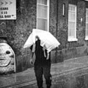 Man Seeks To Keep His Head  Out Of The Wet Rain. Poster