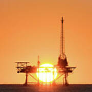Sunset Behind Oil Rig Poster