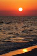 Sunset Over The Ocean And A Beach Art Print