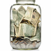 A Clear Glass Jar Filled With Cash And Coins Art Print