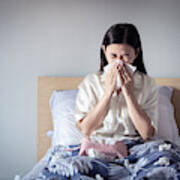 Asian Woman Have A Cold, Sitting On Cozy Bed Using Tissue For Snot. Sick At Home Art Print