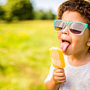 Boy In Sunglasses And Hat Eating Popsicle Outdoors Art Print
