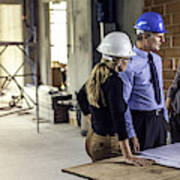 Businessman Talking To Architects At Construction Site Art Print