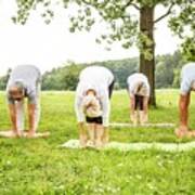 Four People Doing Yoga In Field Art Print