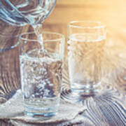 Glass Of Water On A Wooden Table Art Print