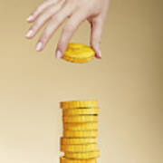 Hand Putting Paper Gold Coin On Stack Of Coins Art Print