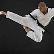 Hispanic Male Karate Black Belt Kicking In Air Art Print