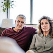 Mature Couple Looking At Psychiatrist In Office Art Print