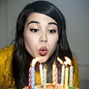 Mixed Race Woman Blowing Out Birthday Candles Art Print