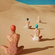 Models Sitting On Sand Dunes Art Print