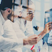 Scientists Looking At A Dna Sequence On The Monitor Art Print