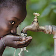 Social Issues: African Black Child Drinking Fresh Water From Tap Art Print