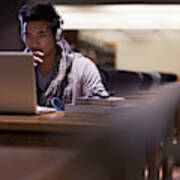 Student Working On Laptop In Library Art Print