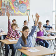 Students With Arms Raised In Classroom Art Print