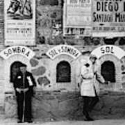 Two Men Posing By A Wall Covered In Spanish Art Print