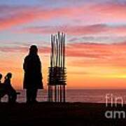 Two Sculptures Two Spectators Sunrise Sculpture By The Sea Art Print