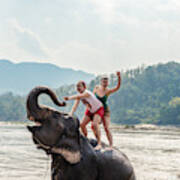 Two Young Women Riding An Elephant In The Mekong Art Print