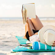 Woman Lies On The Beach Reading A Book Art Print