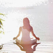 Woman Practicing Yoga On Pier Art Print