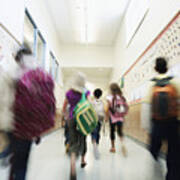 Young Students Walking Down Hallway Of School Art Print