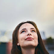 Young Woman Looks Hopeful As She Raises Her Eyes Towards The Sky Art Print