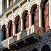 Classical Italian marble building facade with columns arches and