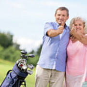 Senior Couple Showing Ok Sign On A Golf Course. Art Print