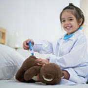 Small Girl Inject The Teddy Bear By Doctor Toy Set On The Bed In Art Print
