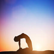 Woman In Camel Yoga Pose Meditating At Sunset Art Print