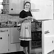 Woman Taking Food From Freezer, C.1950s Art Print