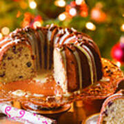High Angle View Of Chocolate Bundt Cake On Cakestand Against Illuminated Christmas Tree At Home #1 Art Print