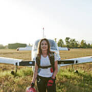 Young Female Skydiver In An Airfield With A Plane Behind Her #2 Art Print