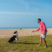 Bearded Man Playing With Dog At Beach In Sunny Day #4 Art Print